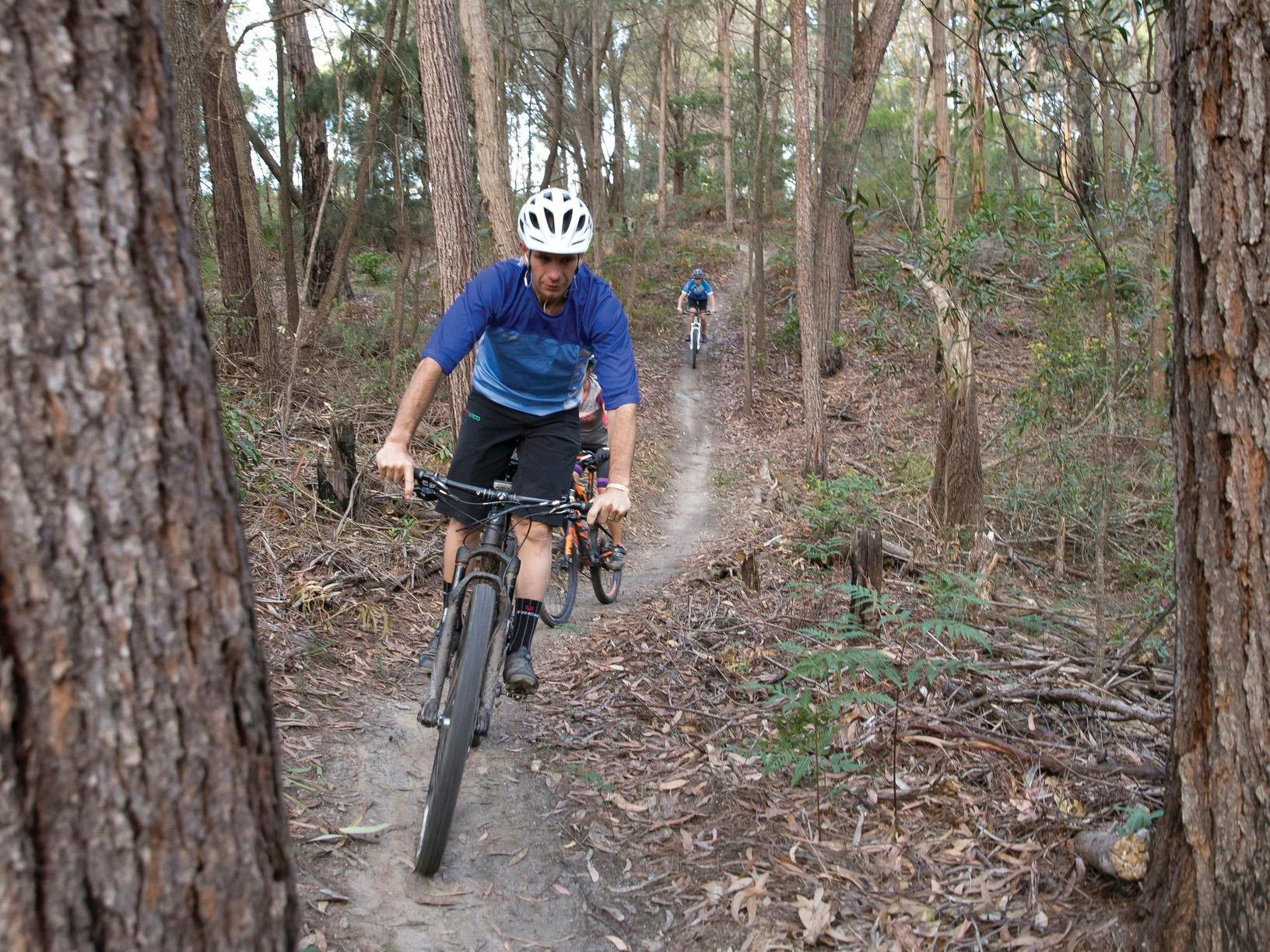 Family enjoying a day of riding on the 20km Bundadung Trail Network in Tathra