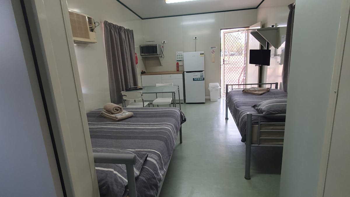 Layout for the inside of cabins 11 to 16. Each has a double and single bed, fridge &kitchenette