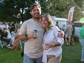 two friends enjoying the sun and wine at the koonara summer fiesta