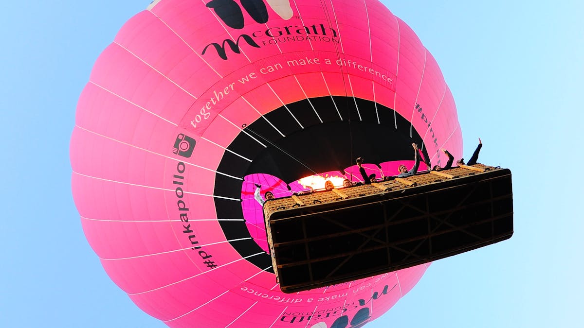 Going UP! Giant Pink Hot Air Balloon Rising into the Air with McGrath Foundation Logo