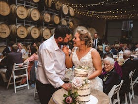 Winery wedding at Cape Jaffa Wines Cellar Door, featuring a barrel room reception with fairy lights