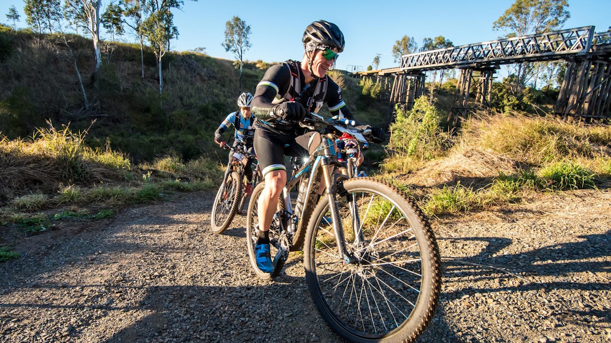 Bike riders passing under the Heritage-listed Lockyer Creek Bridge