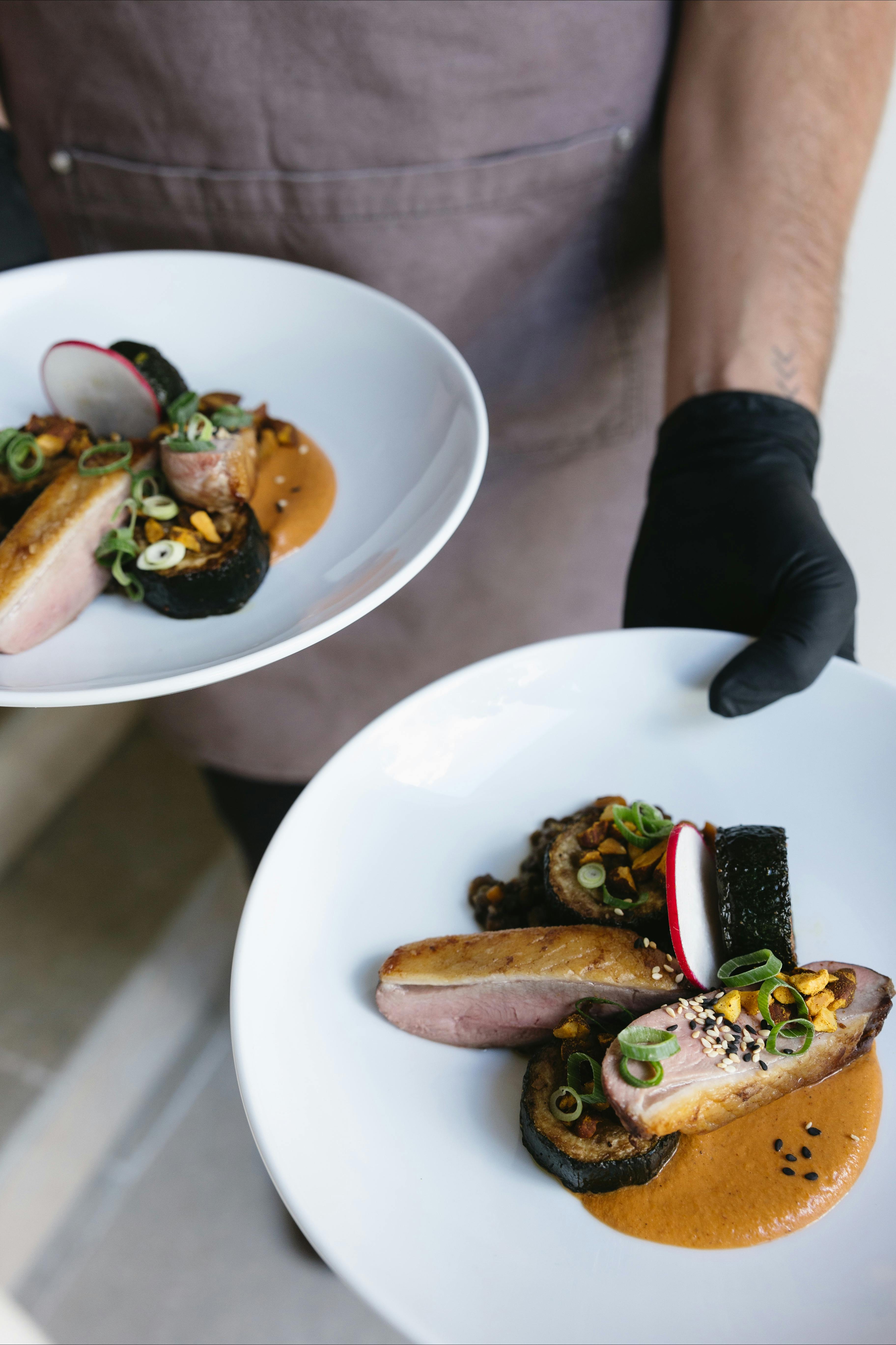 Roasted Duck Breast, creamed corn, grilled leek, pickled onions, chives & artichoke crisps