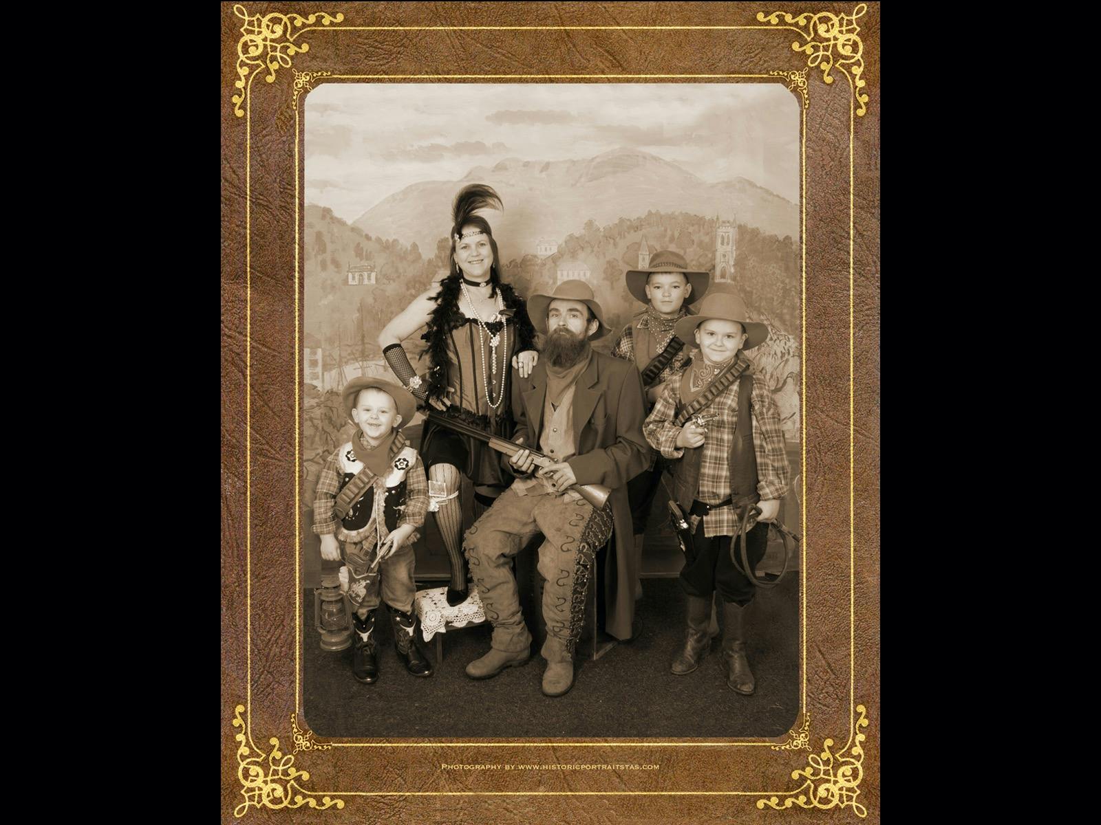 Dress in western costumes to create an Olde Time Portrait