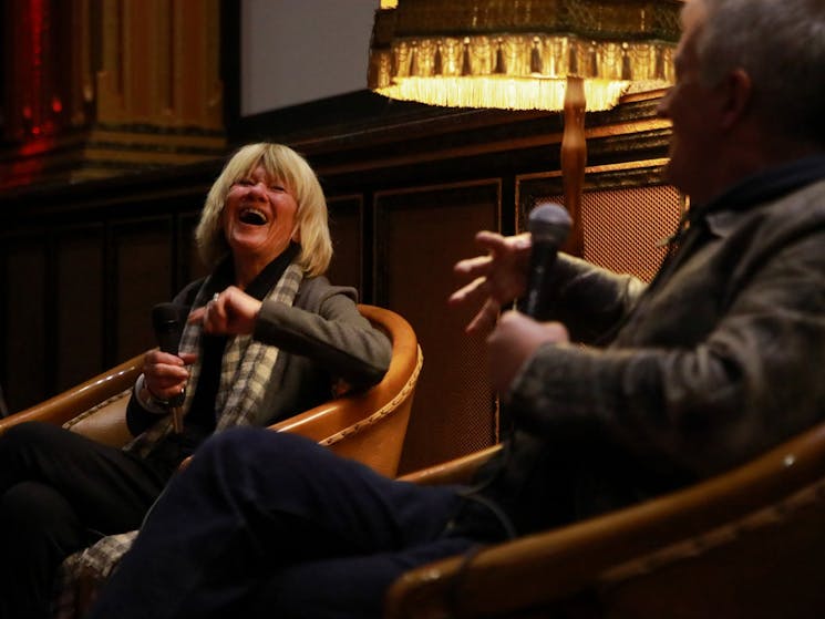 Margaret Pomeranz laughs at something Luke Davies said, seated next to her