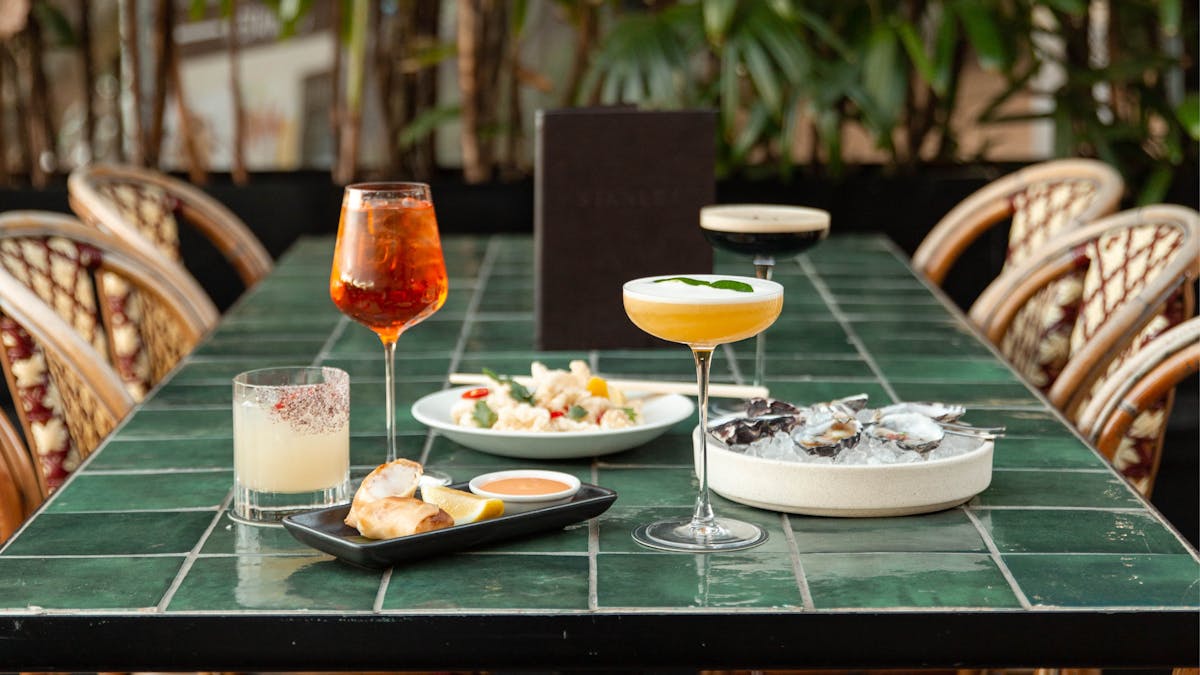 Table setting with cocktails and light bites