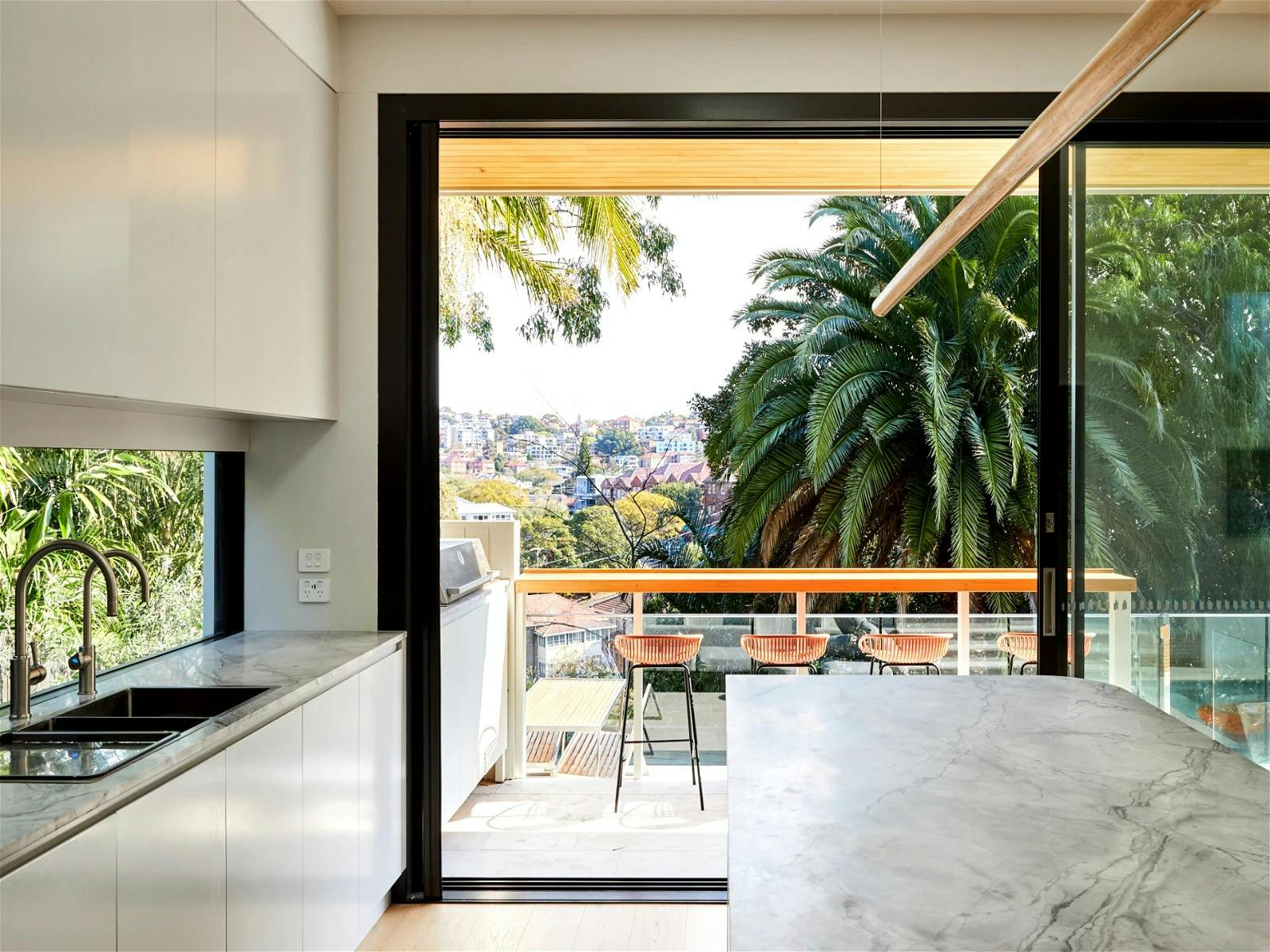 the stunning kitchen, complete with top-of-the-line appliances, marble benchtops and breakfast bar