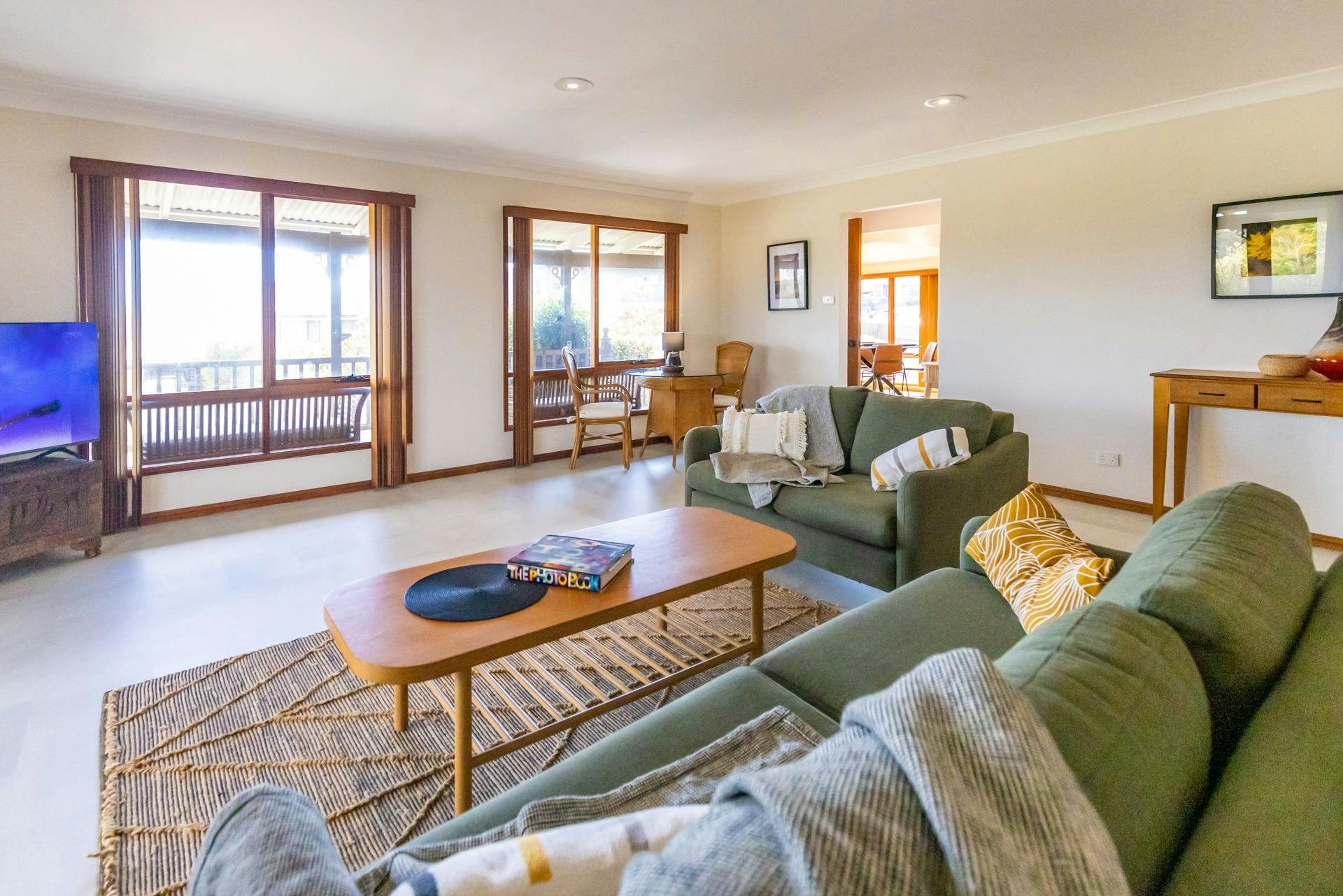 Spacious & cozy sitting room with a view, couches & smart TV in this stylish Dalmeny beach house