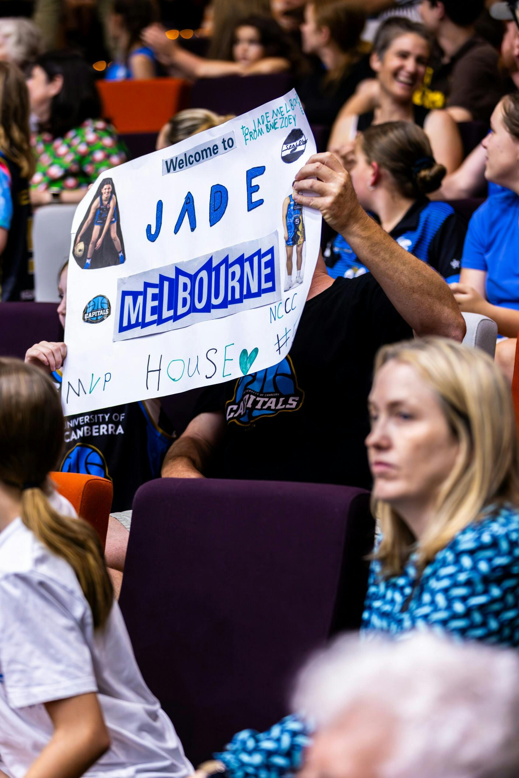 UC Capitals fan holds up sign saying "Jade Melbourne MVP". showing support for the new Uc star......
