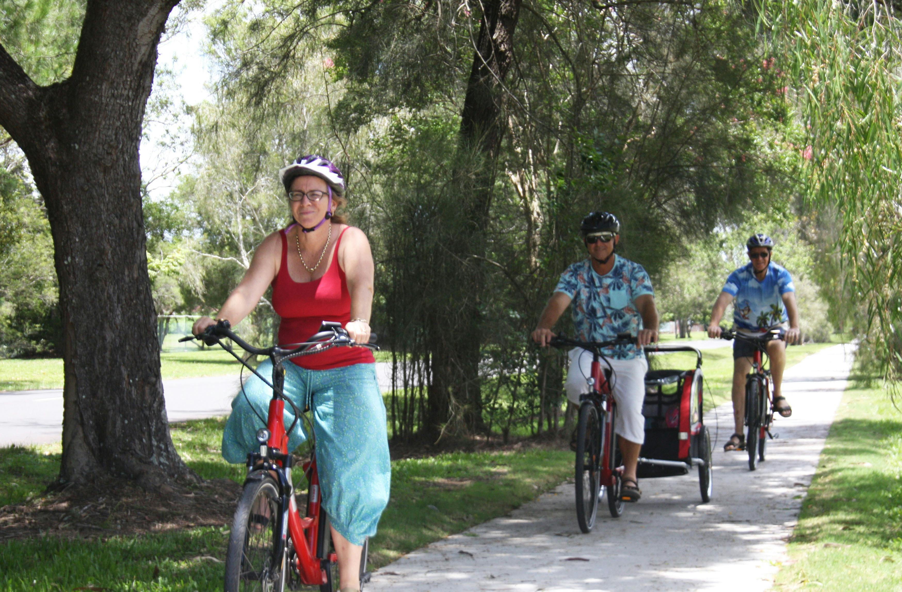 Family riding e-Bike on Bikepaths Yandina