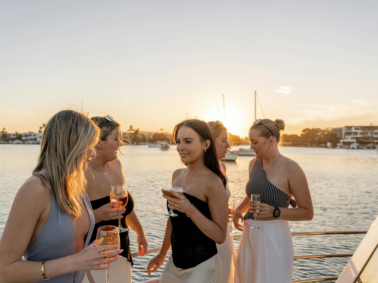 Girls on front deck at sunset Girls on front deck at sunset