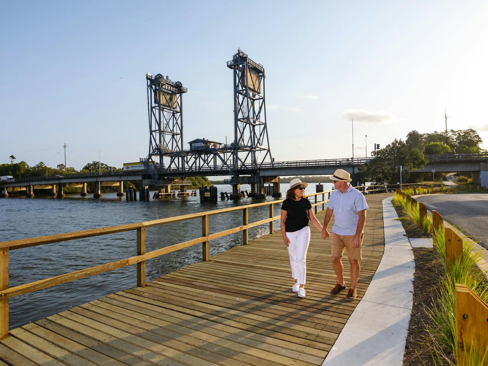 Couple walking along boardwalk at Wardell