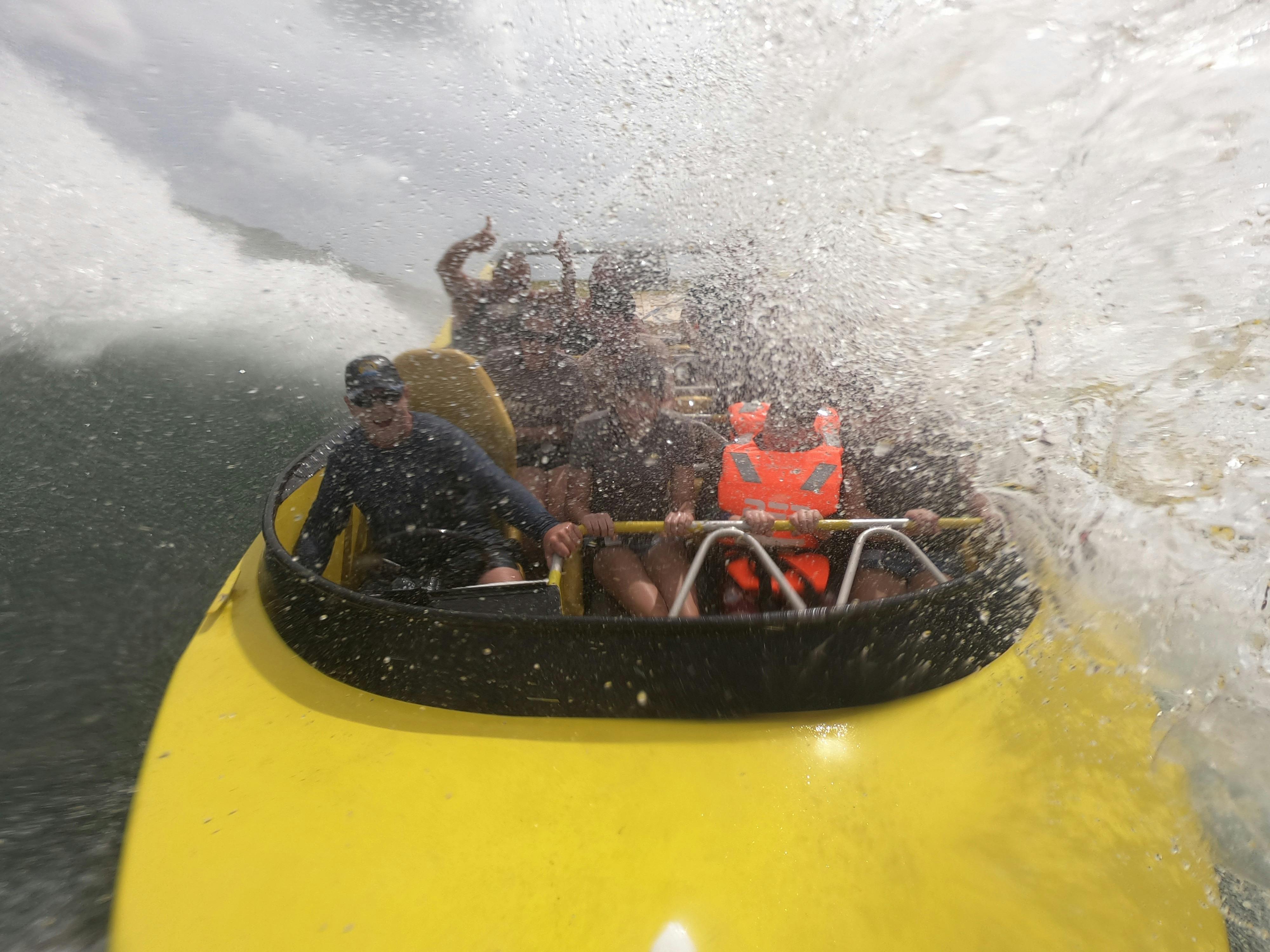 Passengers enjoying jet boat ride