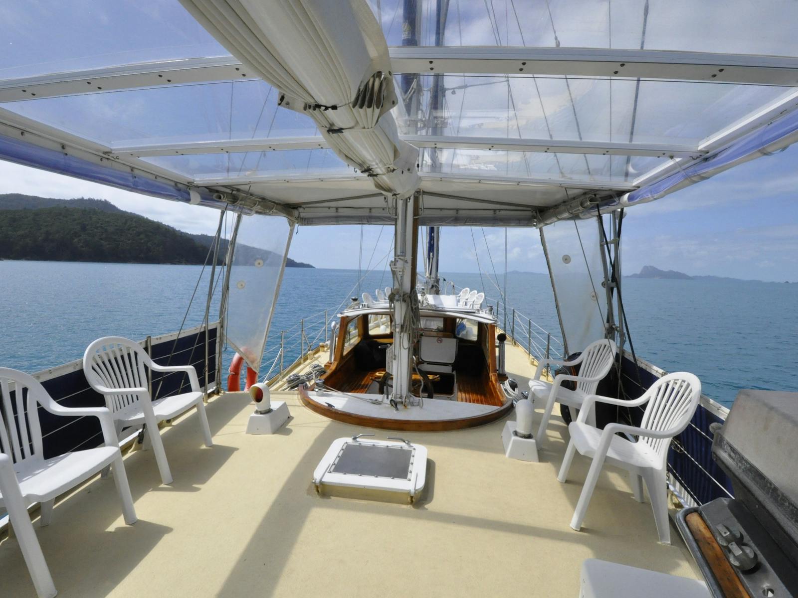 Glass canopy protects in all weather & can be extended forward to protect everyone aboard
