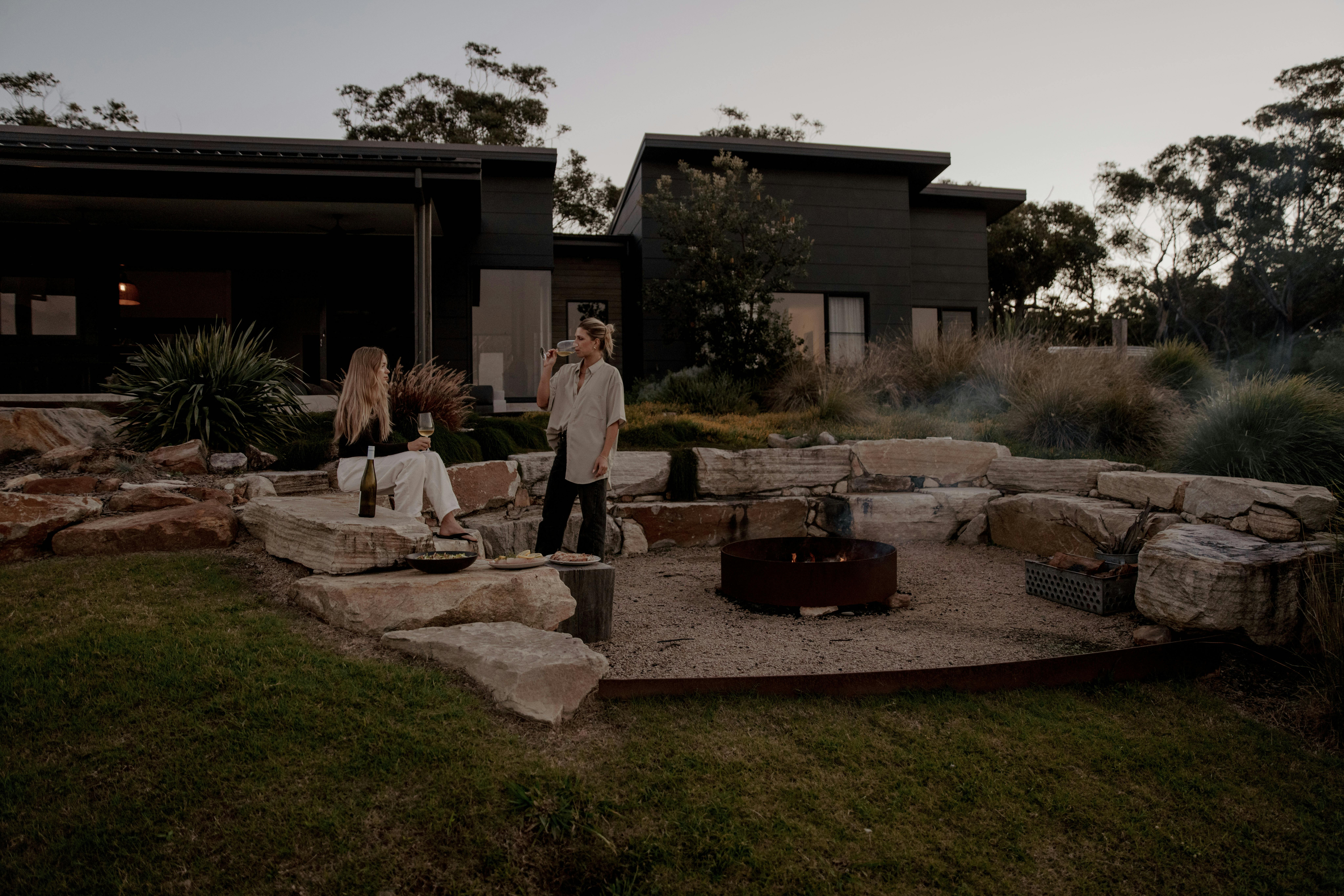 outdoor sunken fire pit and house at Boketto Brooms Head