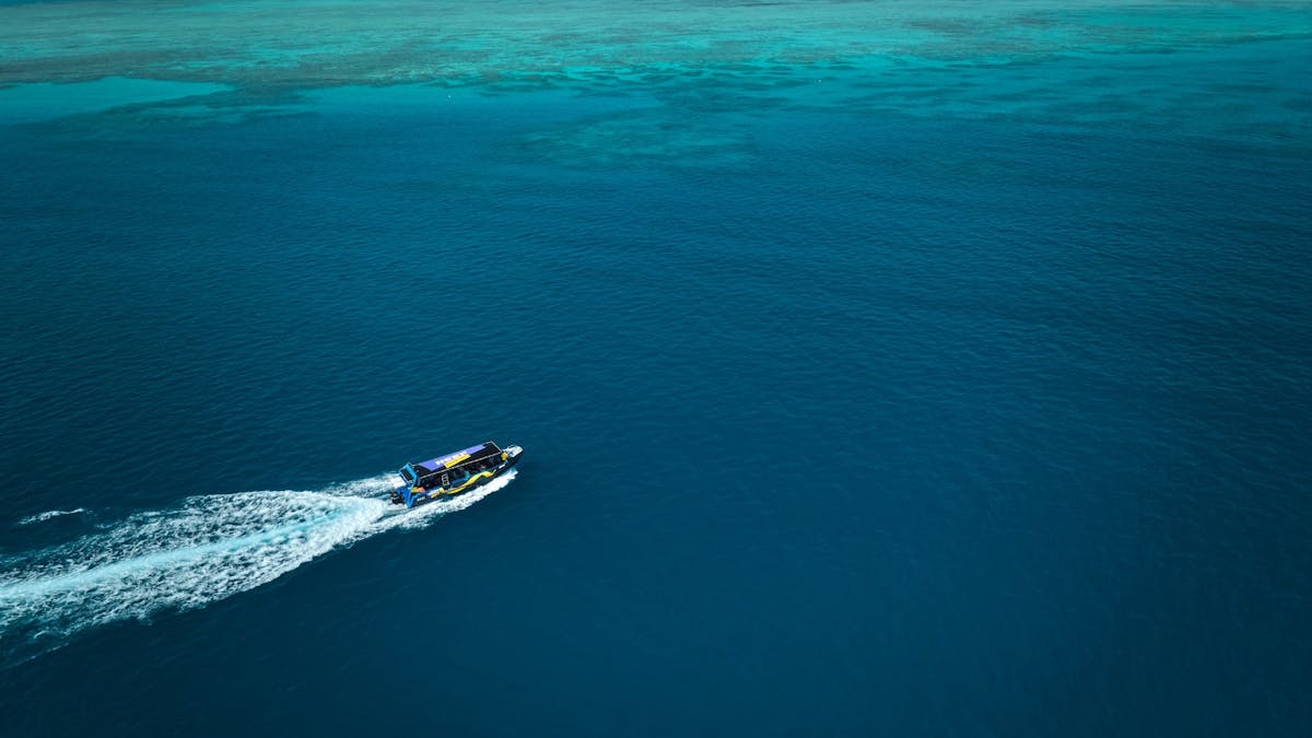 A Birds Eye view of "Mad Max", fast boat streaming along the Great Barrier Reef