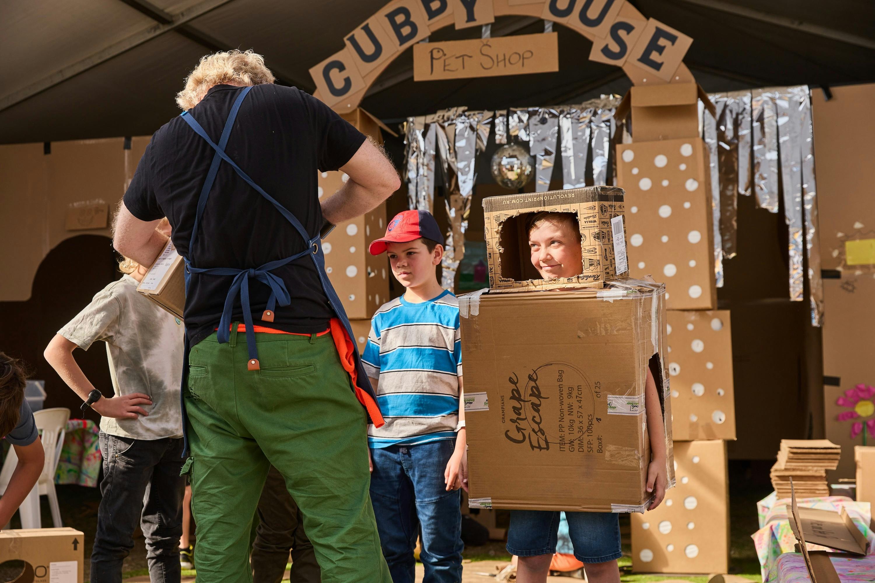 Kids making robot costumes out of old cardboard boxes at Grampians Grape Escape