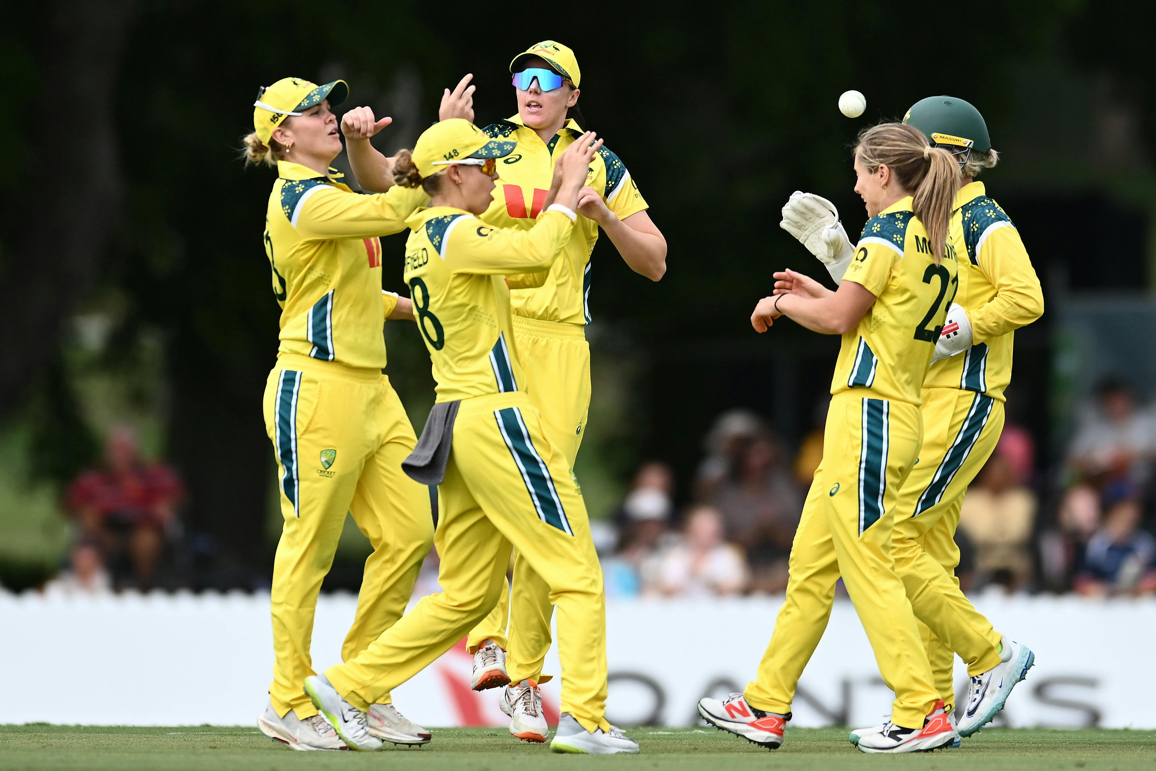 The Australian Women's Cricket Team celebrates a wicket in a One-Day International Match