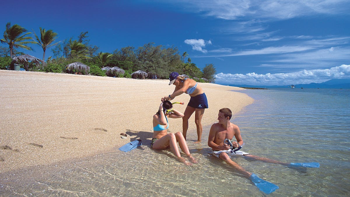 Low Isles snorkelling off the sand cay in the lagoon with Daintree mountains views