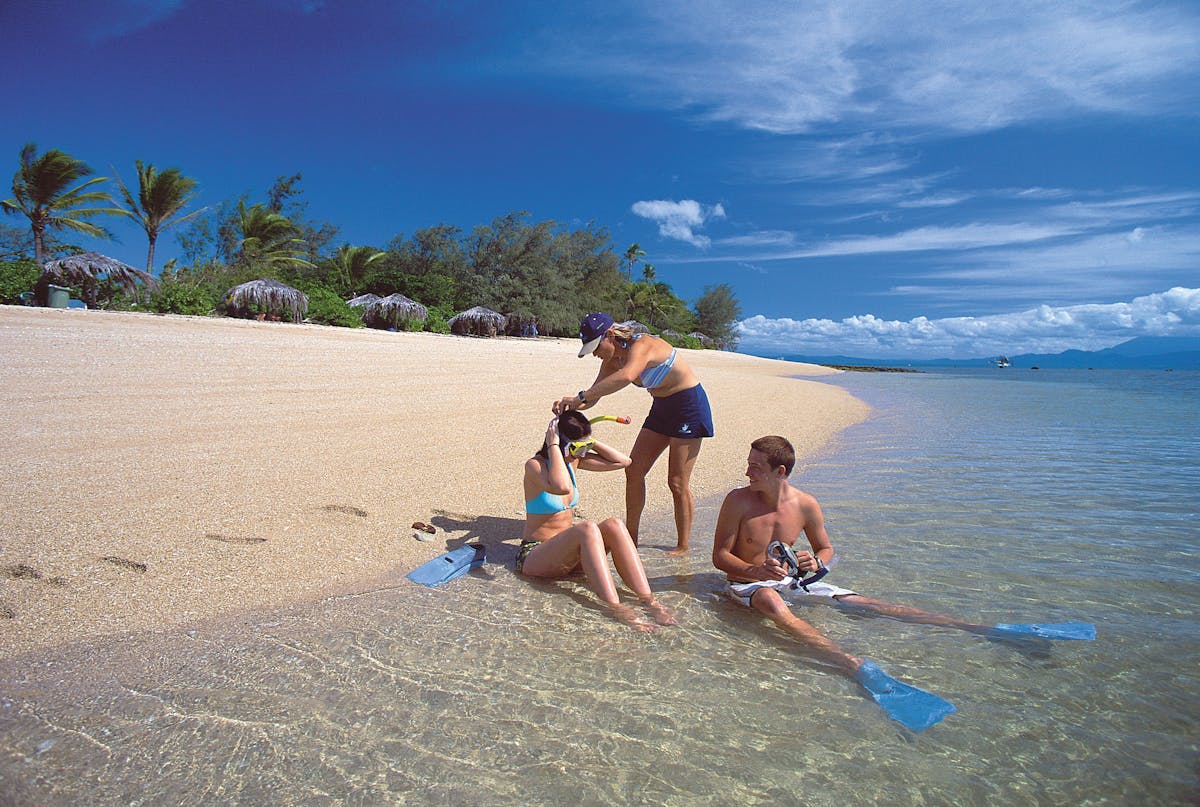 Low Isles snorkelling off the sand cay in the lagoon with Daintree mountains views