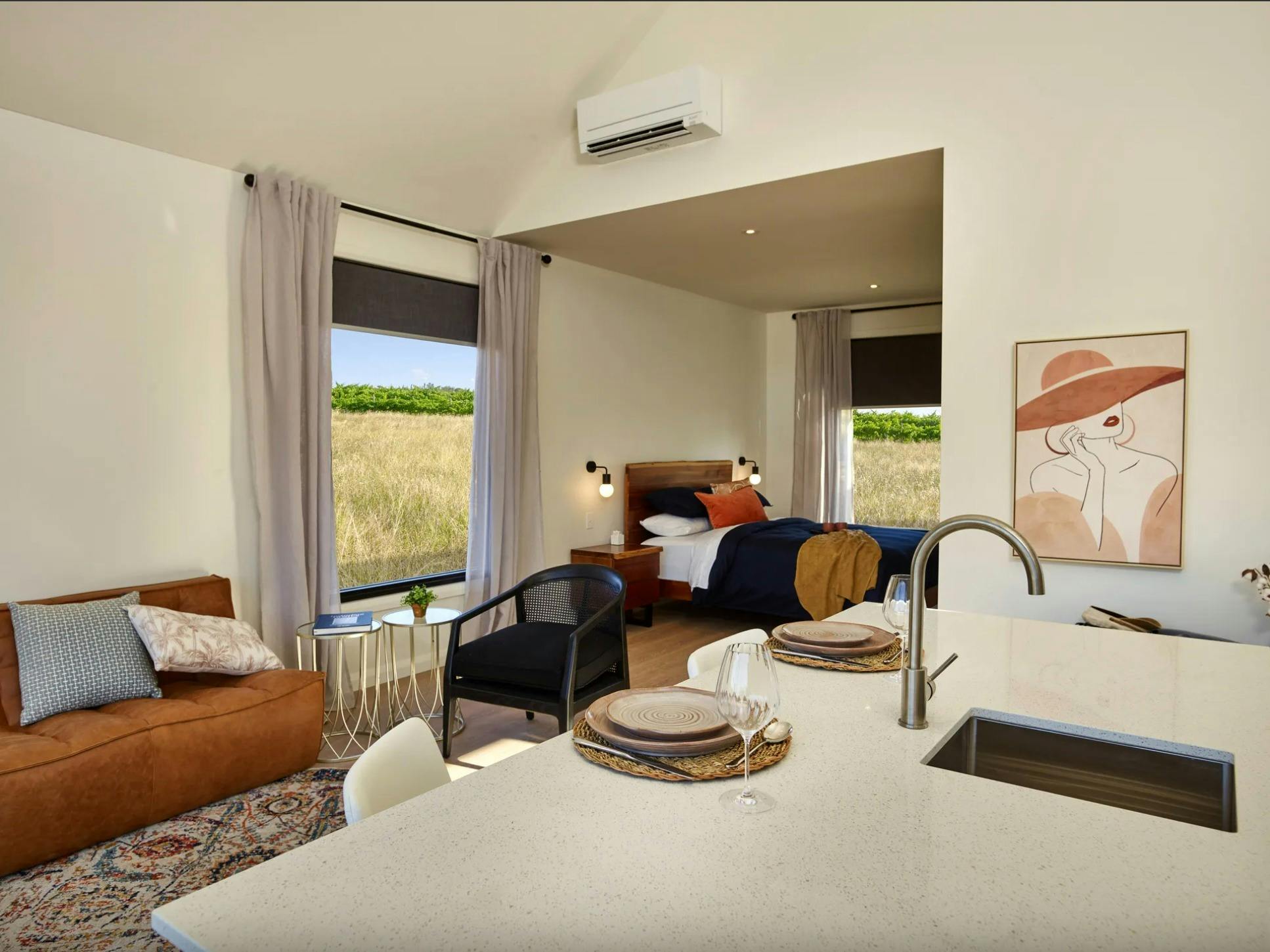 Kitchen table with lounge and bedroom in the background