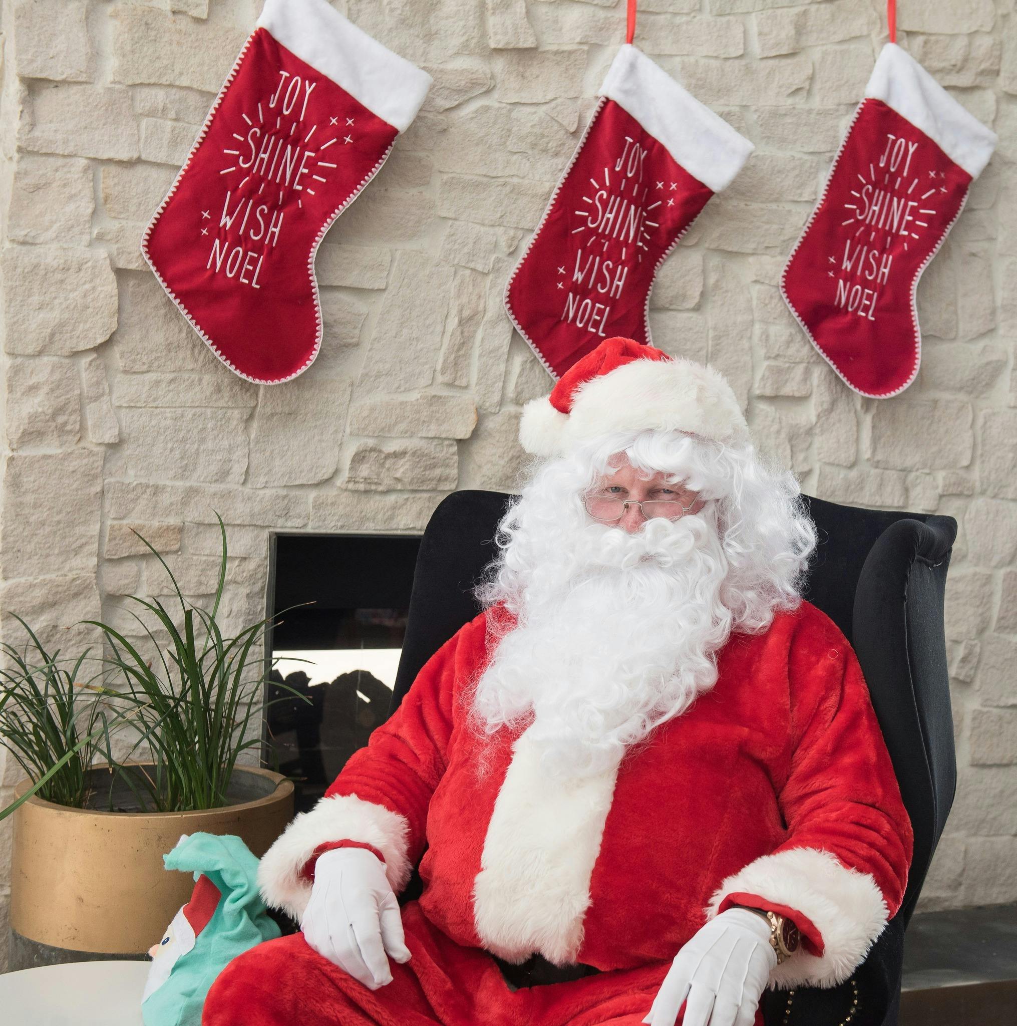 Santa sat by fireside