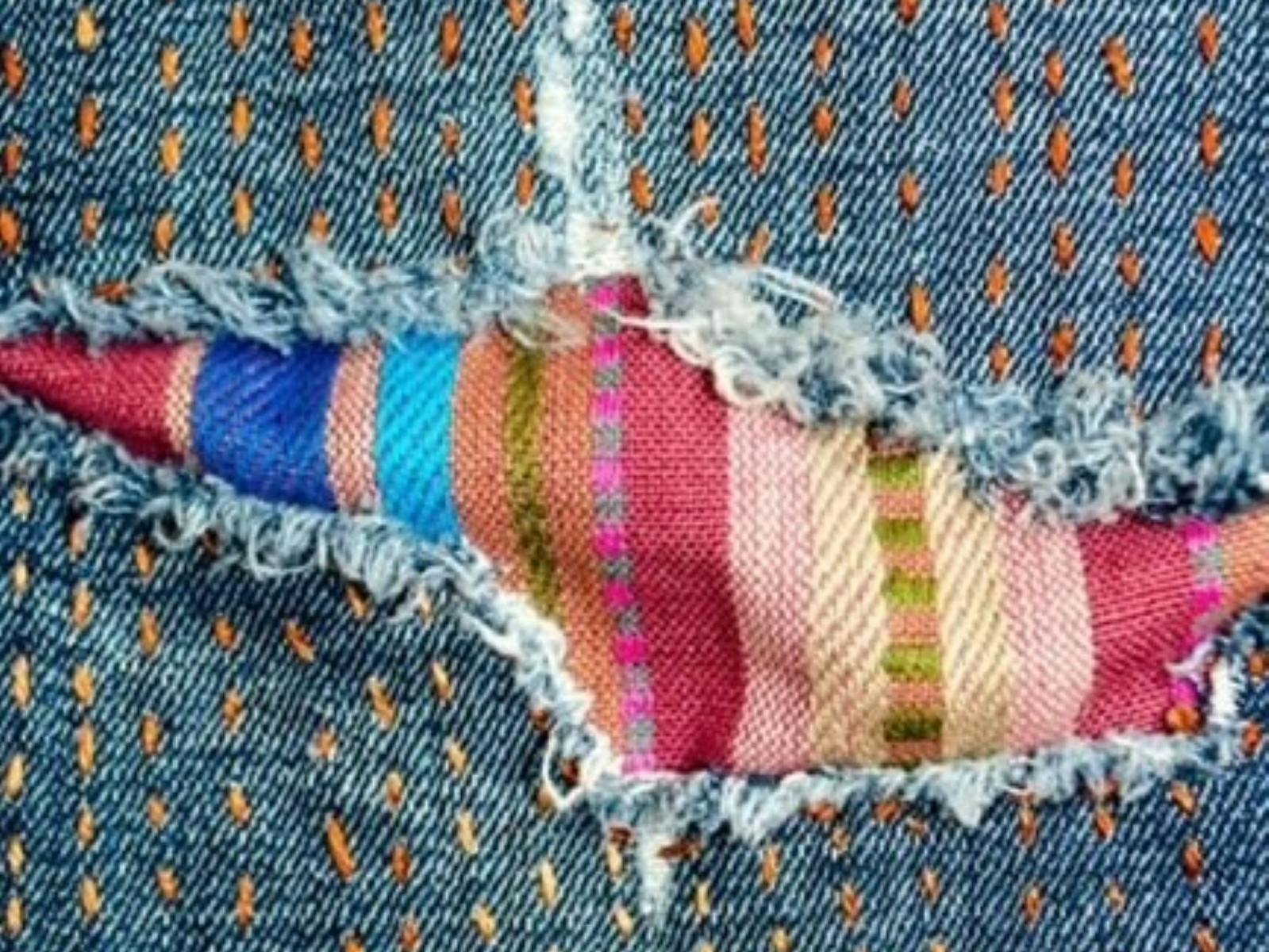Jeans with a rip that has been repaired