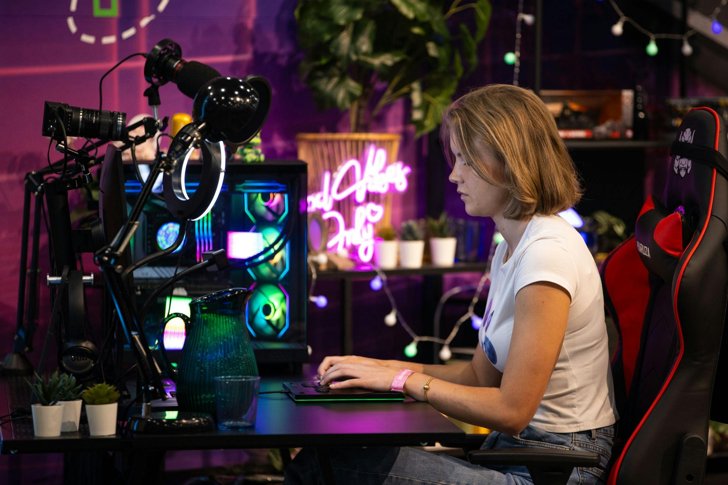Student using a colourful gaming and content creation setup.
