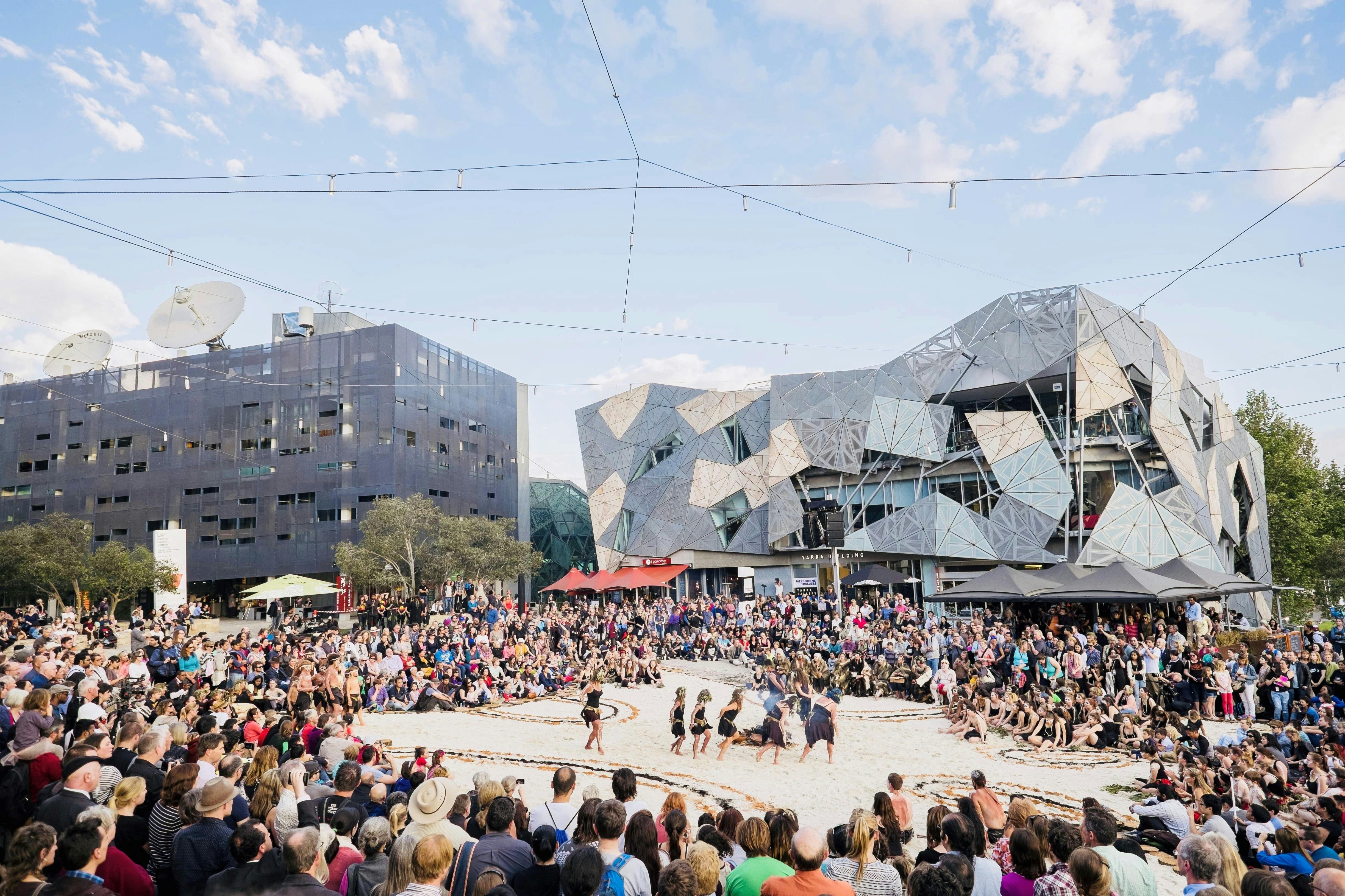 Crowds gather to experience the special Indigenous Tanderrum ceremony at Fed Square.