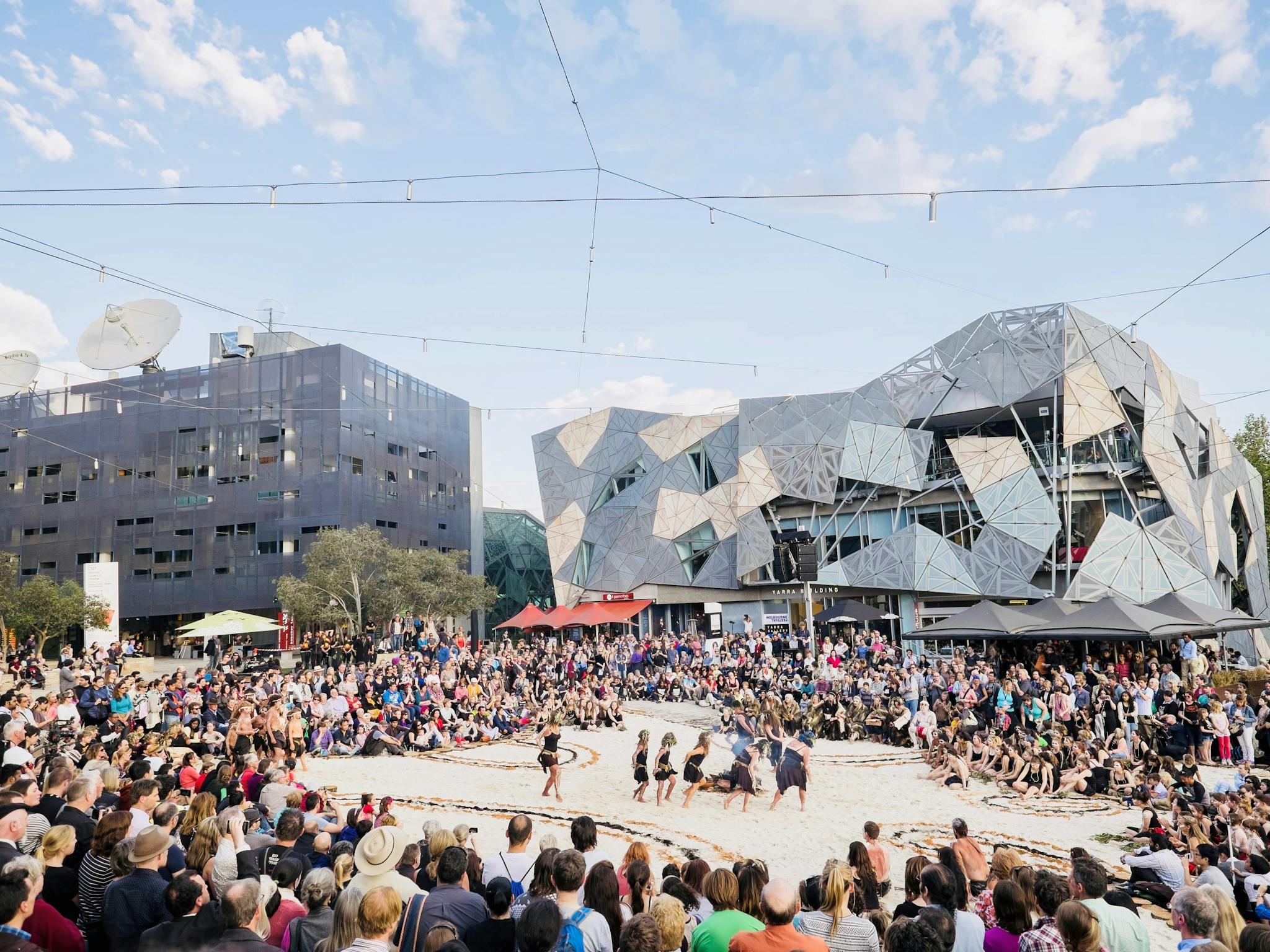 Crowds gather to experience the special Indigenous Tanderrum ceremony at Fed Square.