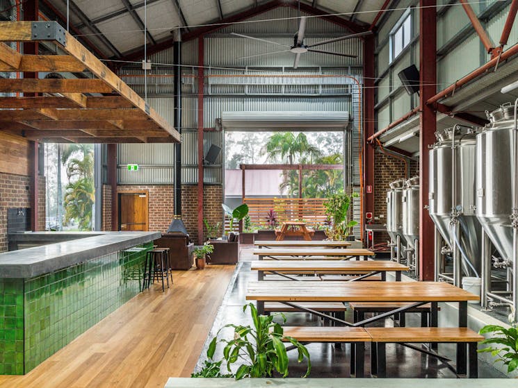 A wide angle shot showing the Common People Brewing Co tasting room and brewery production house