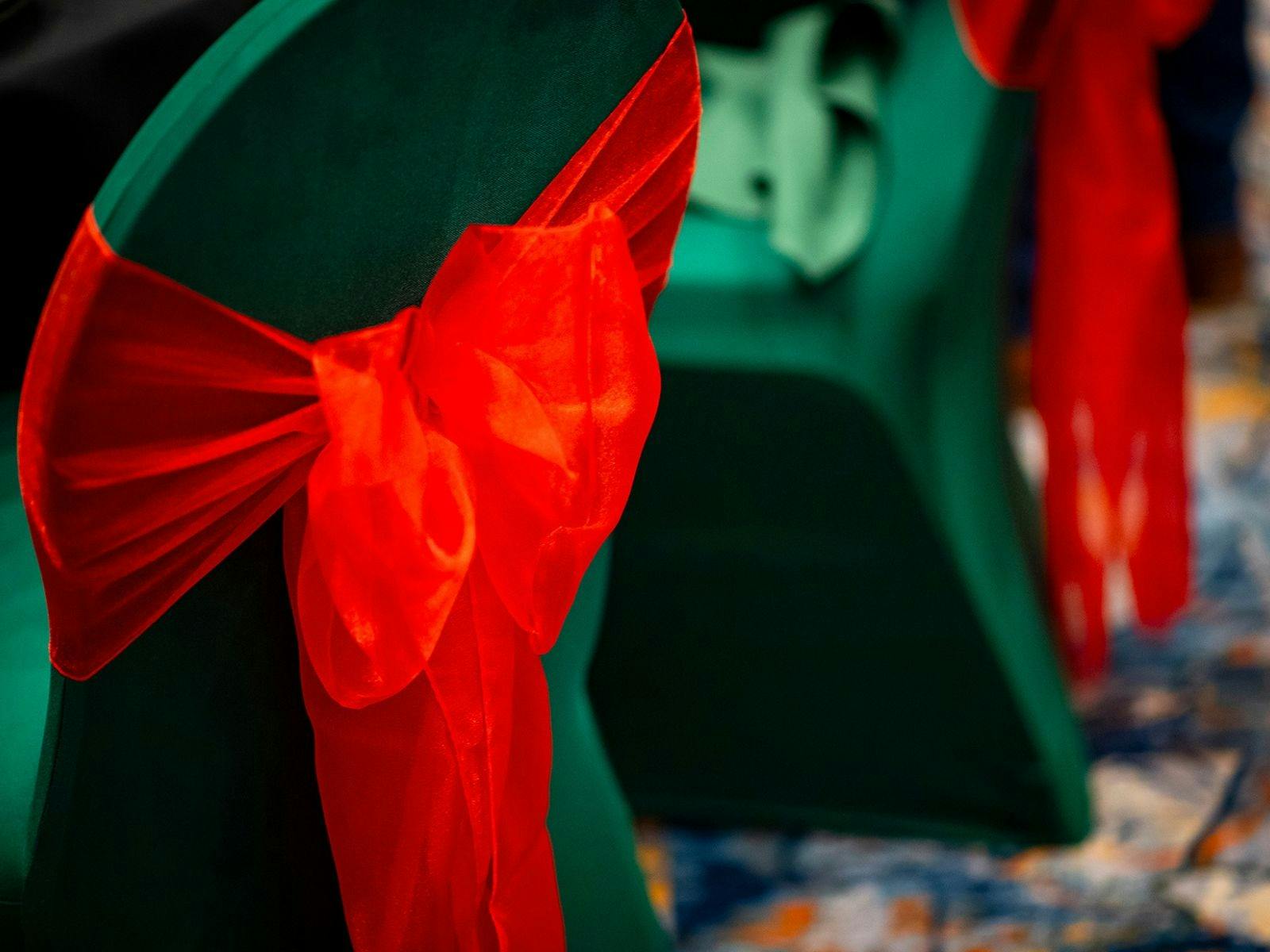 Chair decoration green cover with a red ribbon