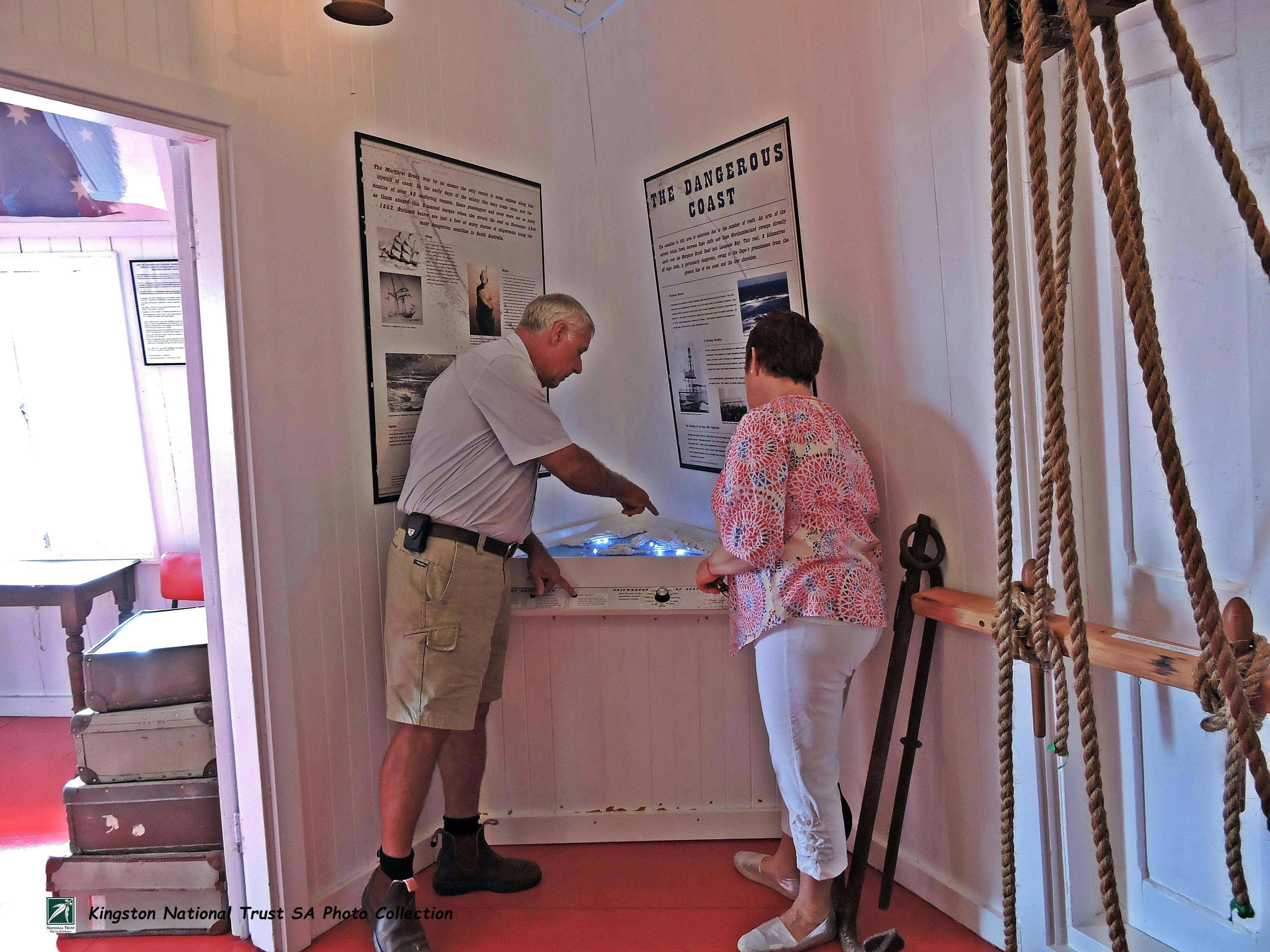 Visitors enjoying the interactive shipwreck map in the Margaret Brock Room