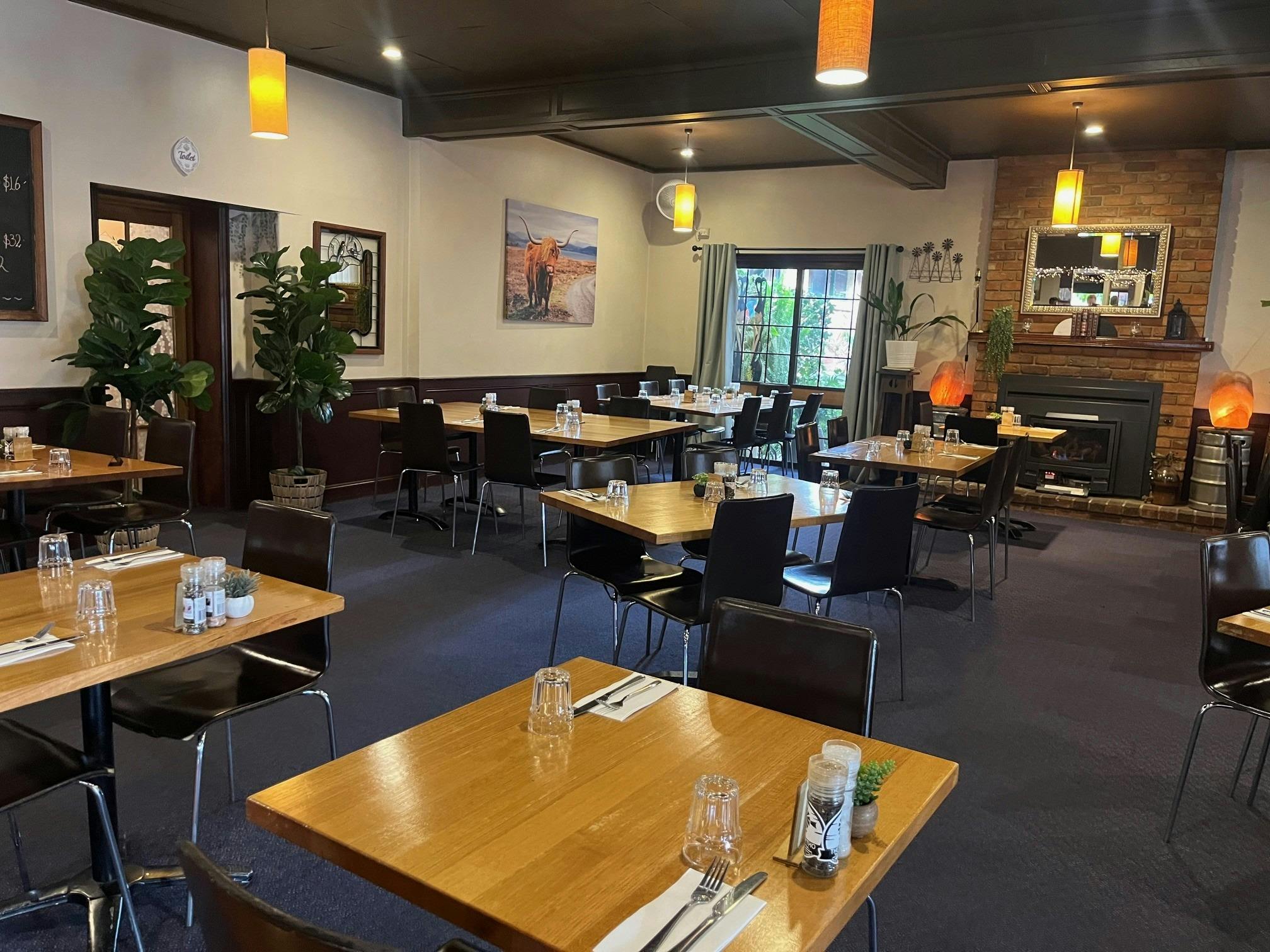 A vast array of dining tables located inside the Northo Hotel