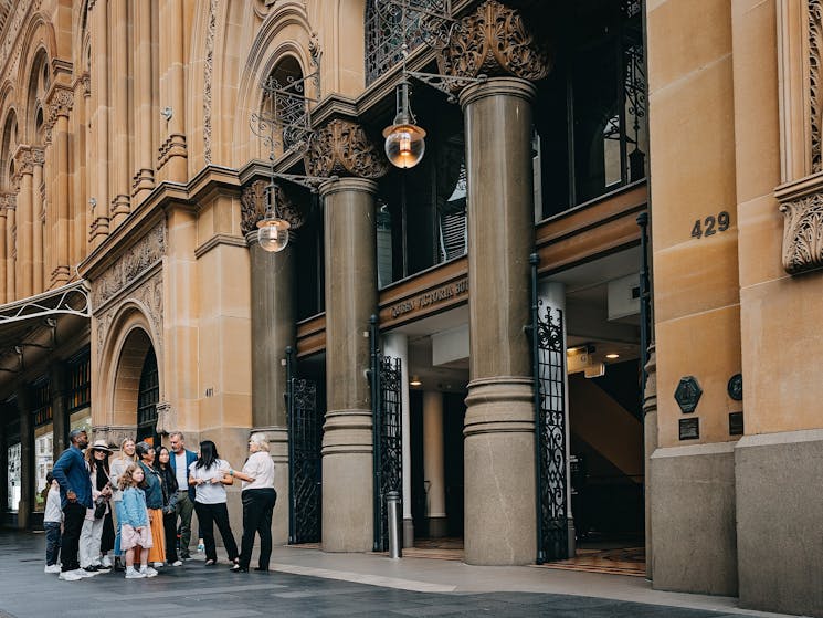 A QVB History Tour group looking at the historical facade outside the QVB on George Street