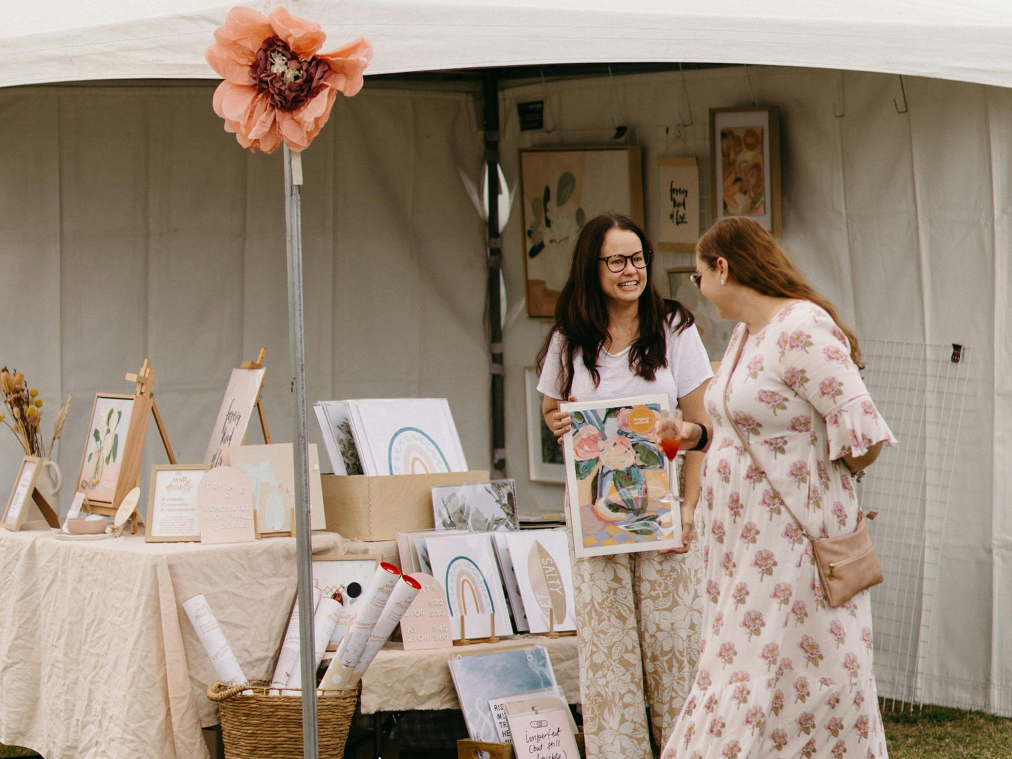 Market stall with woman walking past