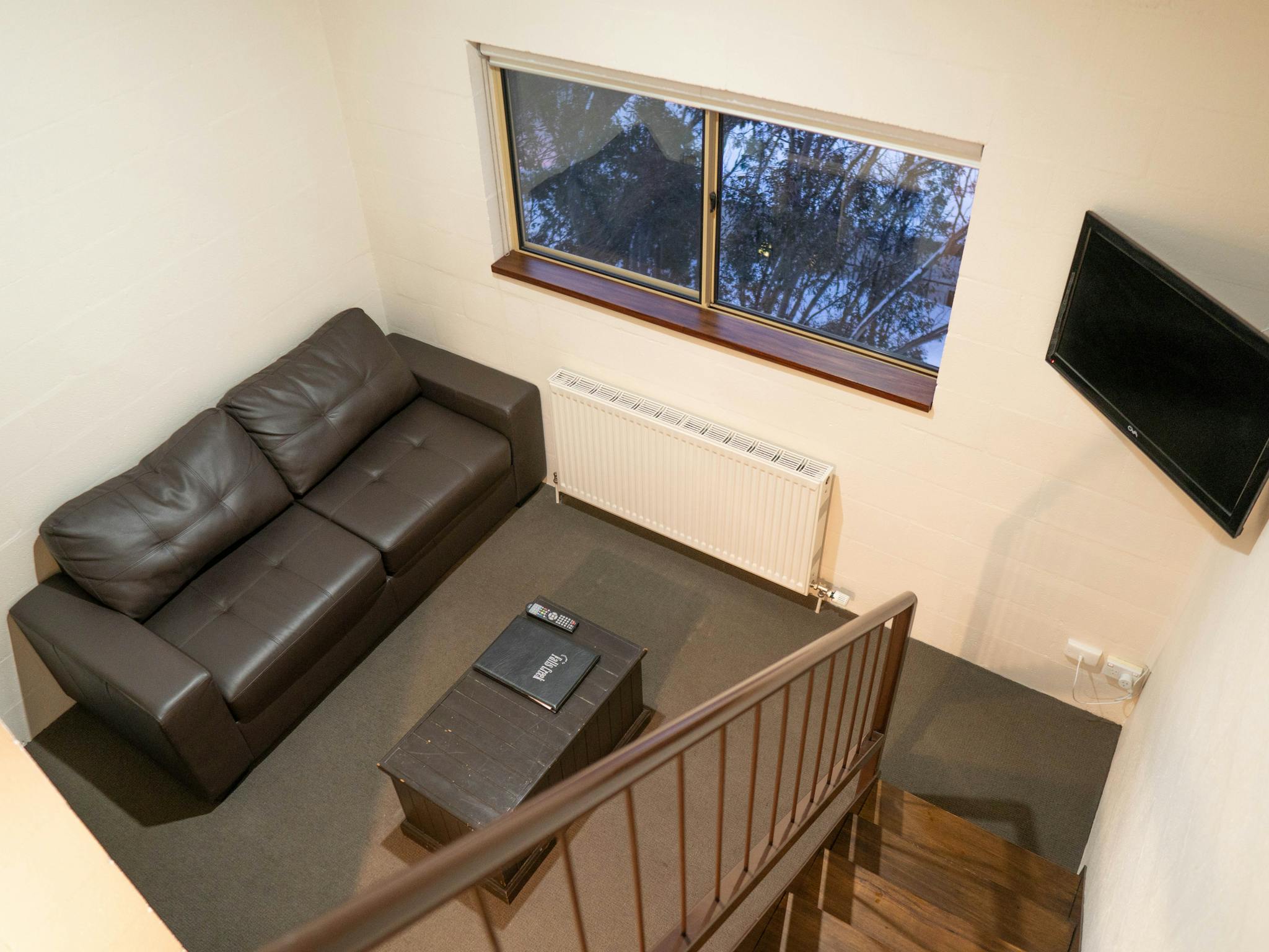 Mezzanine Stairs showing Sitting Room, Stairs, Window and TV