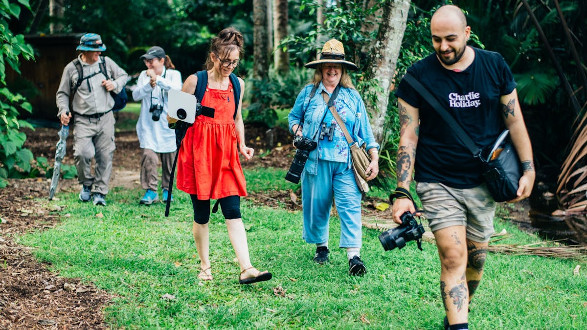 A group of photographers in the beautiful surroundings of the Cairns Botanic Gardens