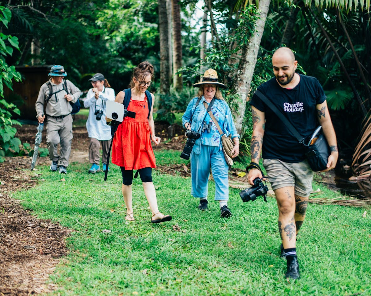 A group of photographers in the beautiful surroundings of the Cairns Botanic Gardens