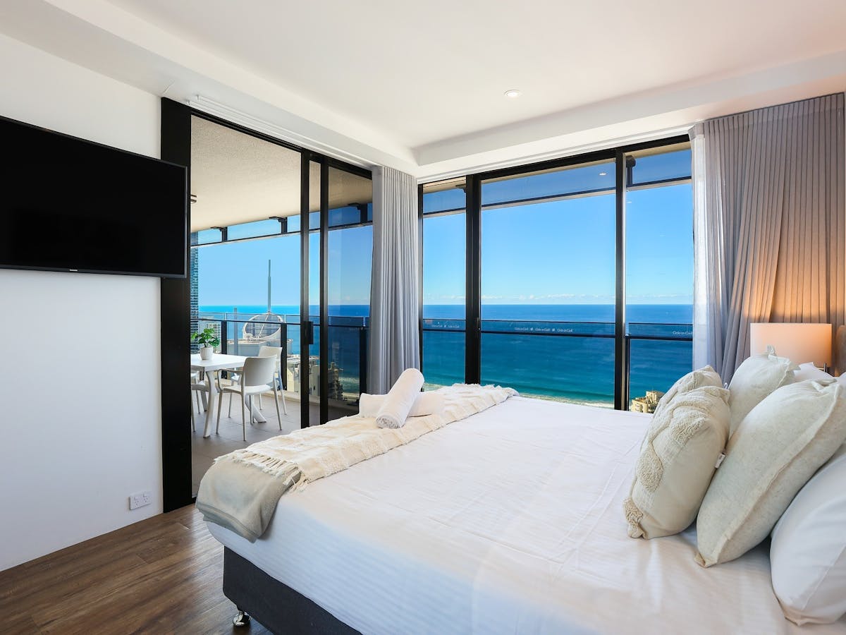 Circle on Cavill Surfers Paradise, bedroom with a sliding door access to balcony, view of the ocean