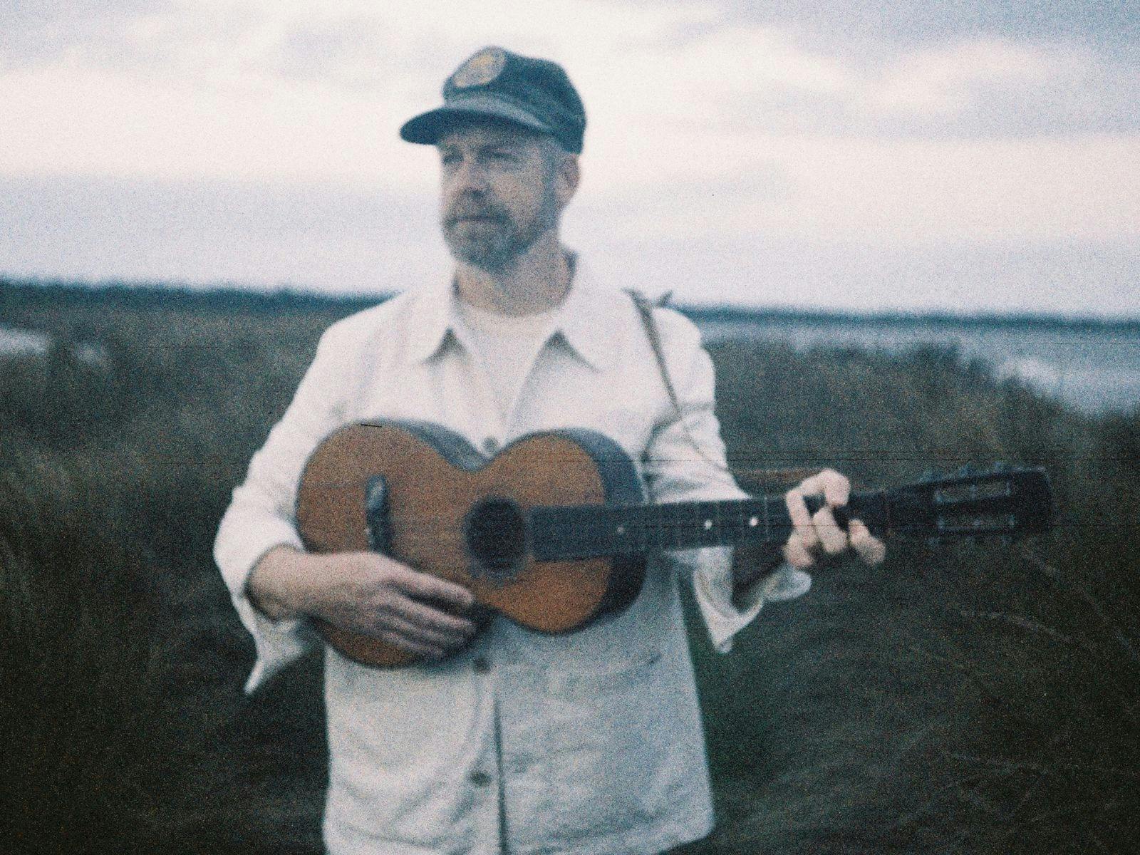 Man holding a guitar