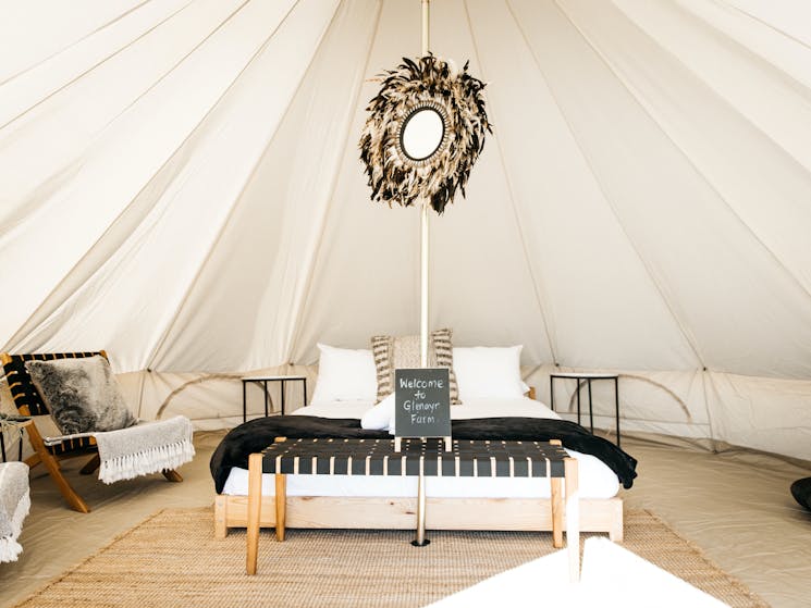 Our bell tents are a spacious 5m dia with stunning views, private dining and egg swings