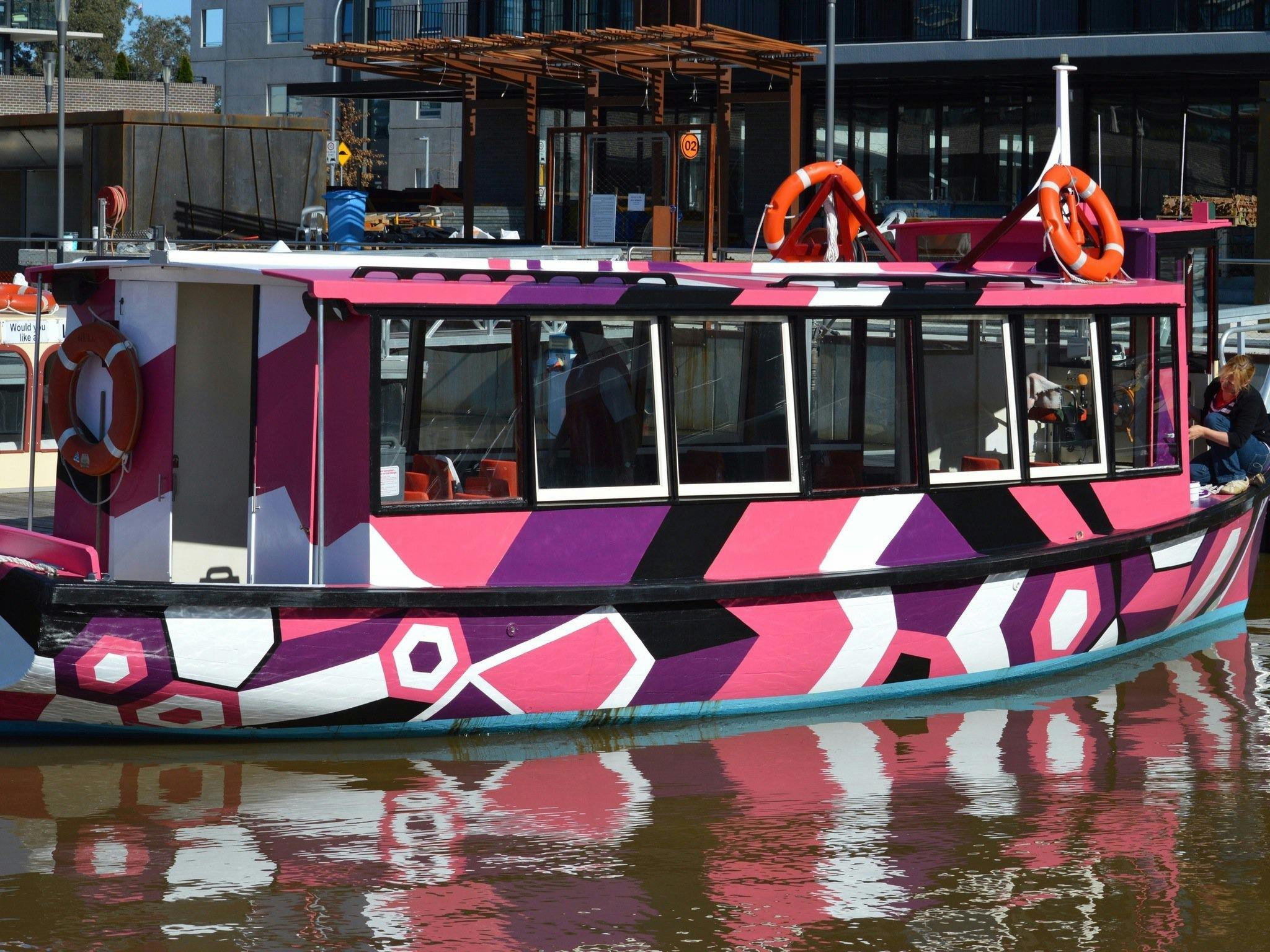Brightly coloured boat on the water