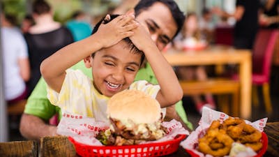 Father and son enjoying their meal