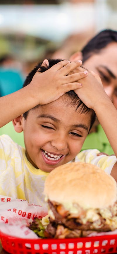 Father and son enjoying their meal