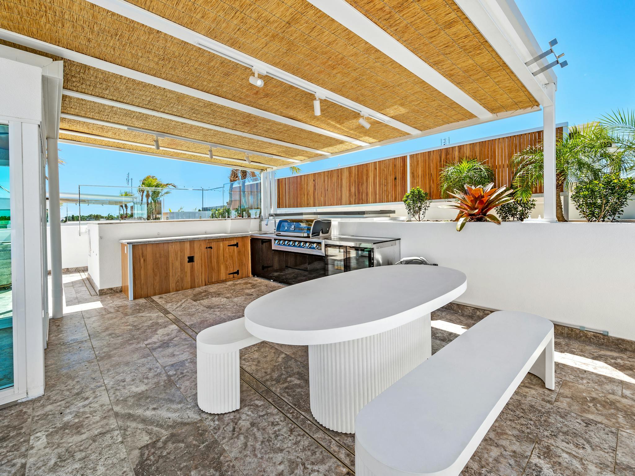 A barbeque, fridge, dining setting and plunge pool create a fabulous outdoor entertaining area