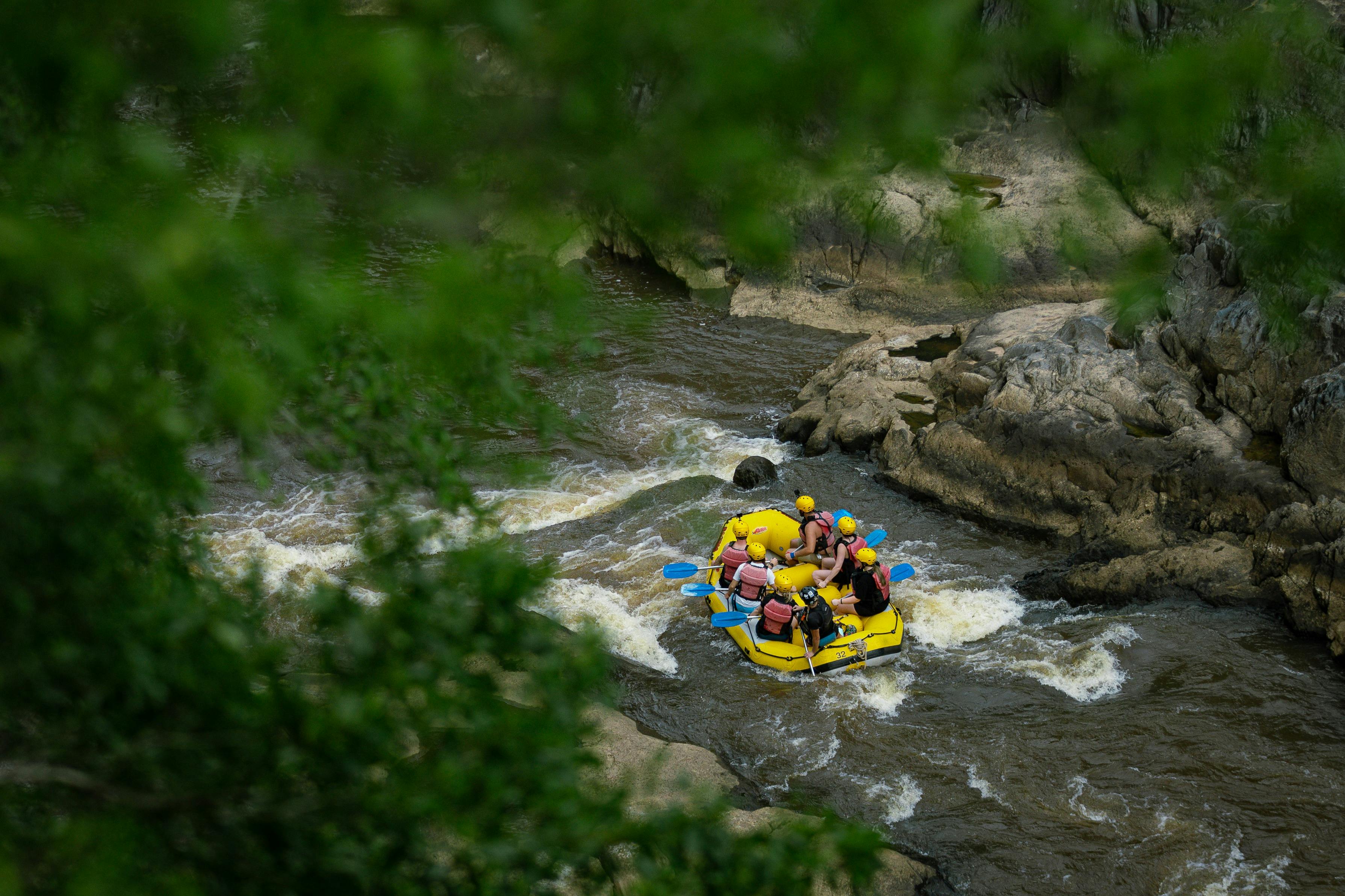 Scenic Aerial Shot of Group White Water Rafting the Barron Gorge National Park River