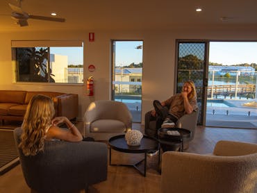 Shared lounge area over looking the pool  Mackay Adventure Lodge