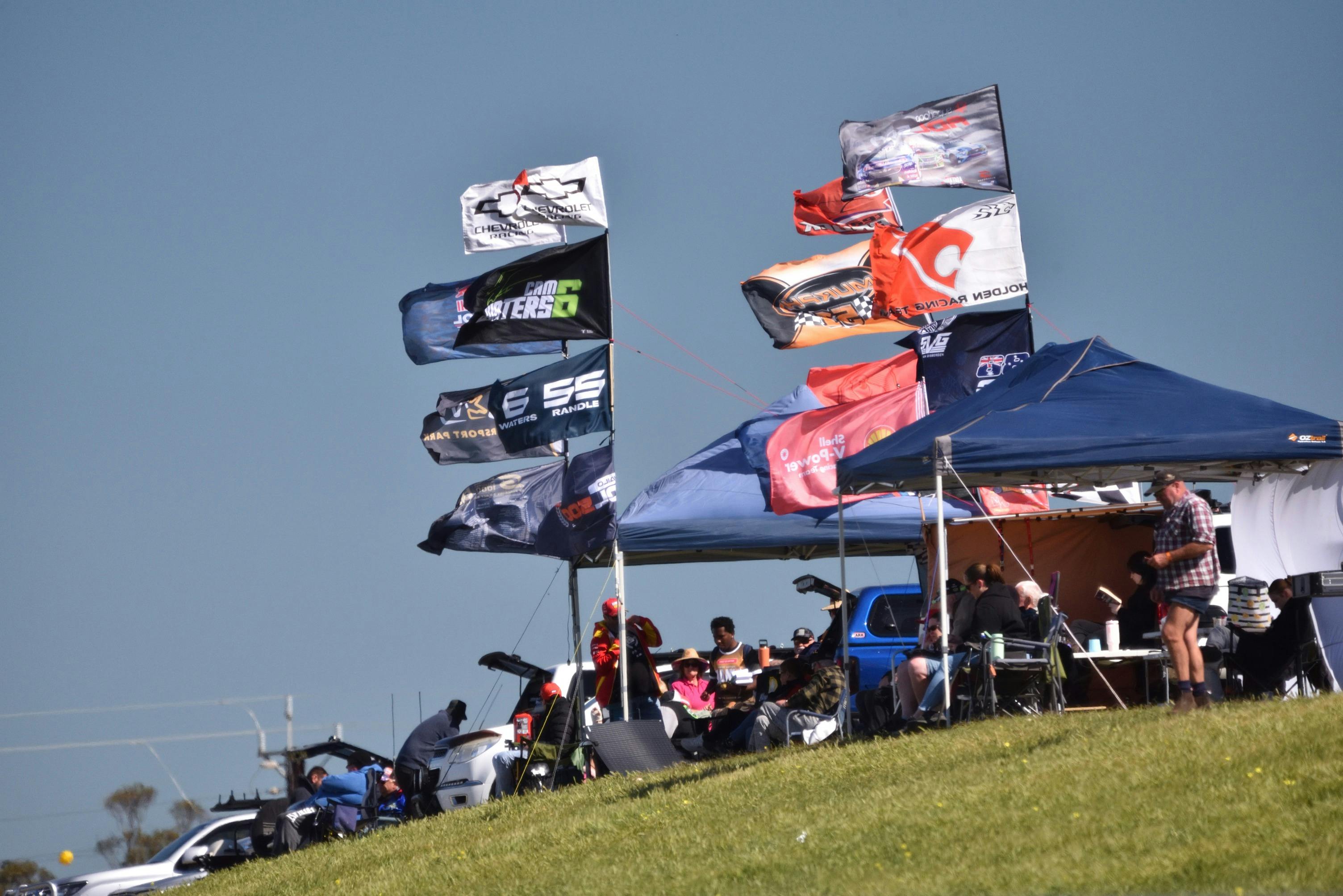 Parn and view fans watching racing trackside