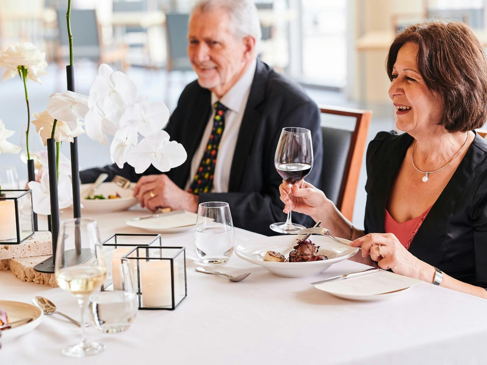 Woman and man enjoying dinner at Parliament House